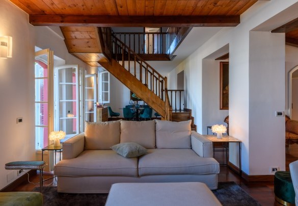 Living room with sofas and the internal staircase – Villa Fiola