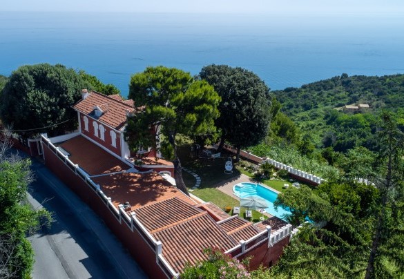 Aerial view of the villa with pool and the sea beyond – Villa Fiola