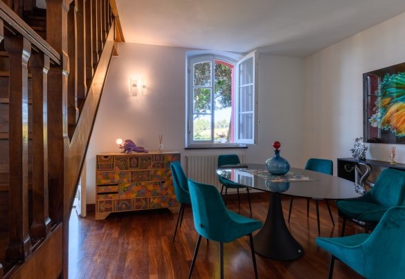 Dining area in the living space overlooking the garden – Villa Fiola