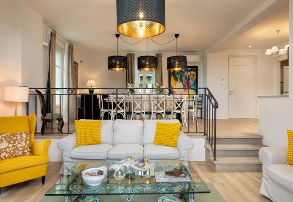 The open space living and dining area  room, with the dining table in the background - Villa Francesca