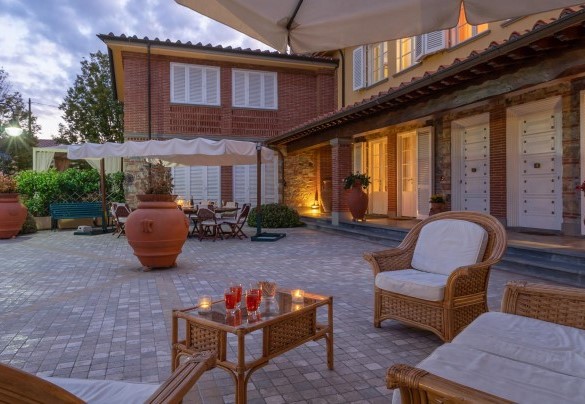 The outdoor living areas colored by the sunset - Villa Gabri