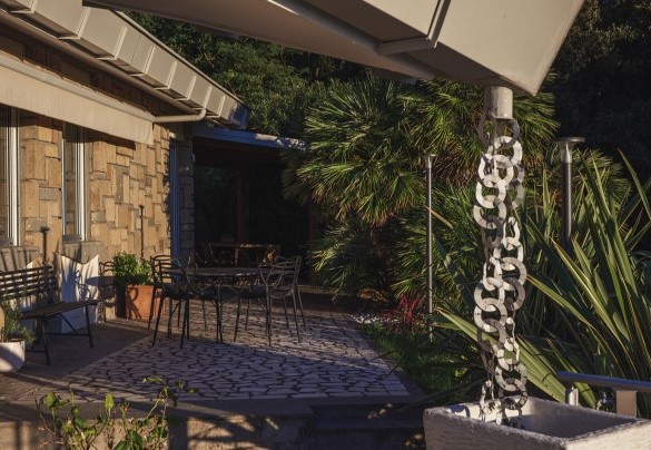 The terrace surrounding the house features two outdoor dining areas – Villa Giulia