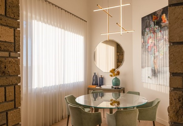 Dining area in the spacious living room with the characteristic exposed stone walls – Villa Giulia
