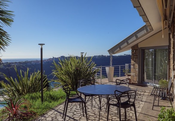 The terrace surrounding the house features two outdoor dining areas – Villa Giulia