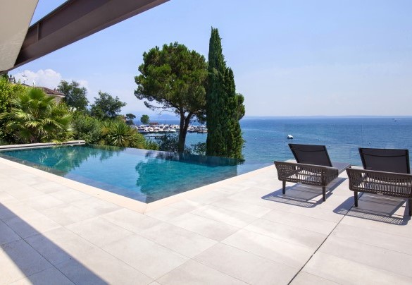 View of the swimming pool from the kitchen on the ground floor	- Villa Grace