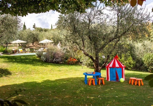 Children's play area and the pool in the background - Villa Il Colle di Moriano