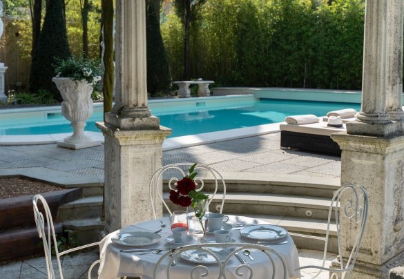 The romantic stone and wisteria gazebo next to the pool - Villa Irma