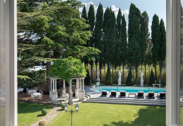Pool located to the southwest along the perimeter wall of the park bordered by bamboo - Villa Irma