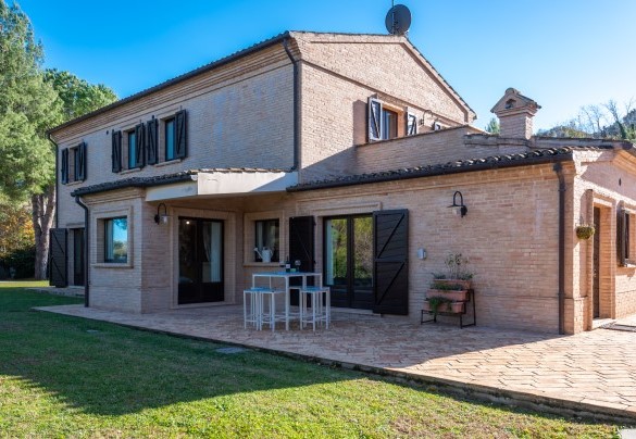 In the paved area, in front of the kitchen, is an area equipped with table and chairs – Villa Isotta