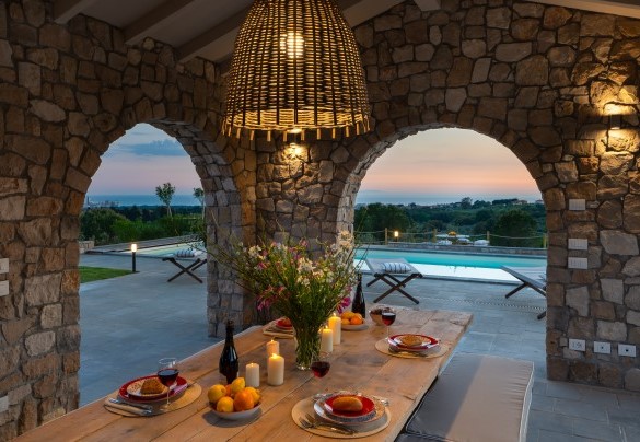 Table and benches under the porch in front of the kitchen - Villa La Casina