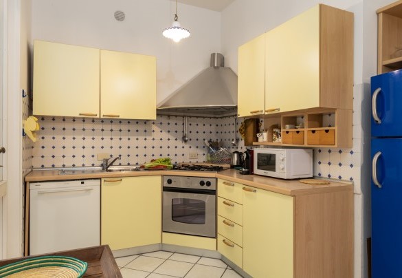 The Kitchen at the exit of portico set up for dining - Villa La Meridiana
