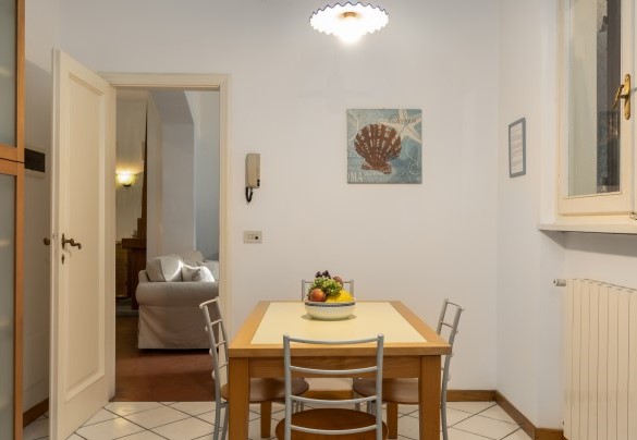 The Kitchen at the exit of portico set up for dining - Villa La Meridiana