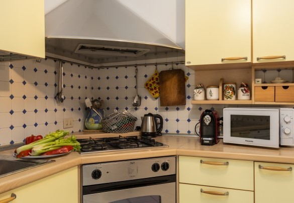 The Kitchen at the exit of portico set up for dining - Villa La Meridiana