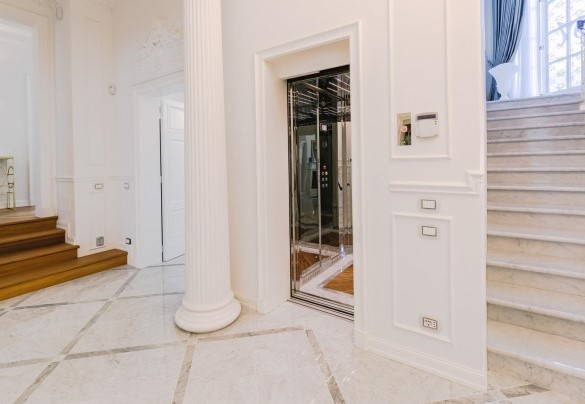 An elevator and marble stairs connect the various floors - Villa La Perla Bianca