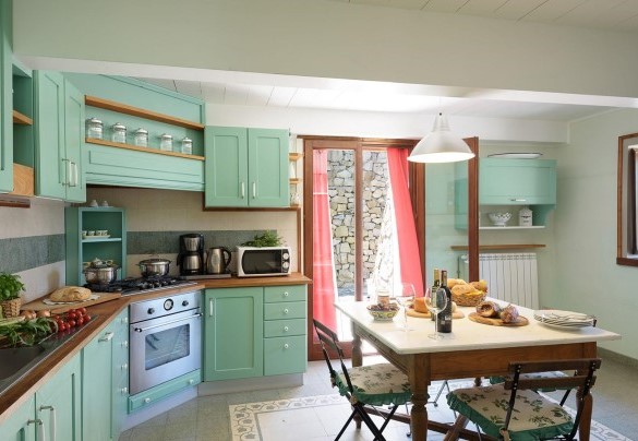 The large kitchen with direct exit to the outdoor dining area – Villa La Poiana 10
