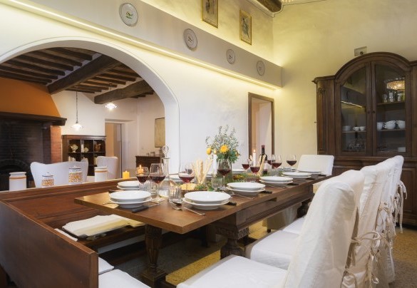 The kitchen with dining area with the table set up for important lunches - Villa Le Logge