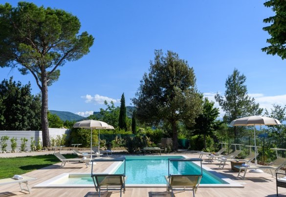 The pool offers panoramic views of the countryside and surrounding mountains - Villa Lia
