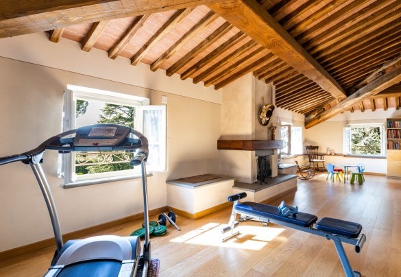 The living area with fitness corner and children's play area at the second floor – Villa Luigina