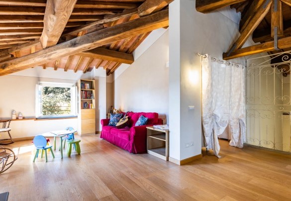The living area with fitness corner and children's play area at the second floor – Villa Luigina
