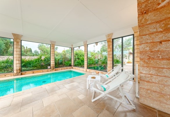 The indoor pool with a view of the external park   - Villa Manco