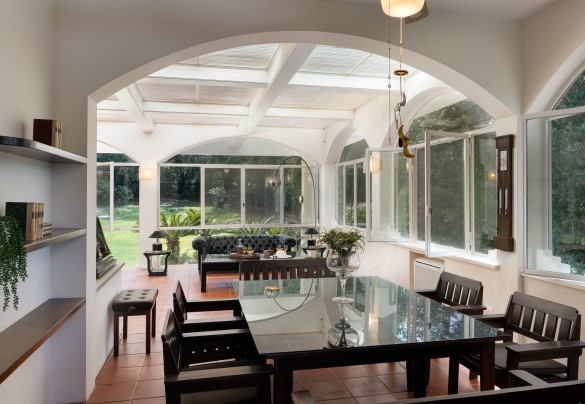 The large veranda set up with living and dining areas, grand piano and study corner - Villa Manganelli