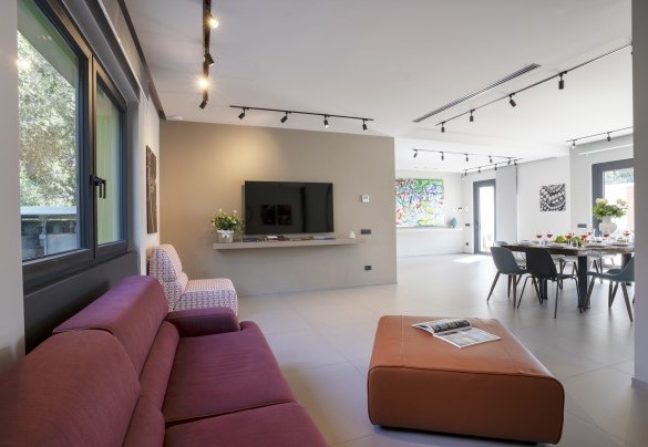 Sitting room in the open-plan living connected by French windows to the pool area - Villa Maria Paradiso