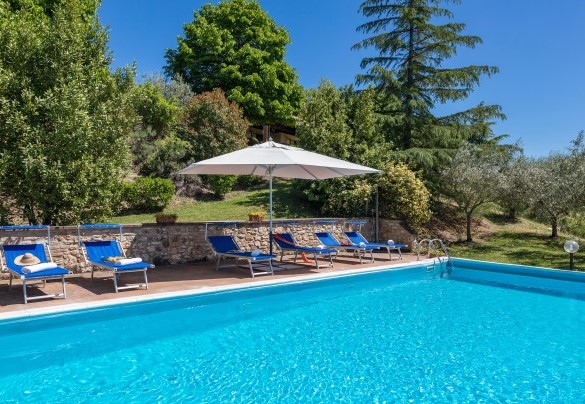 The pool is located within the garden - Villa Mila