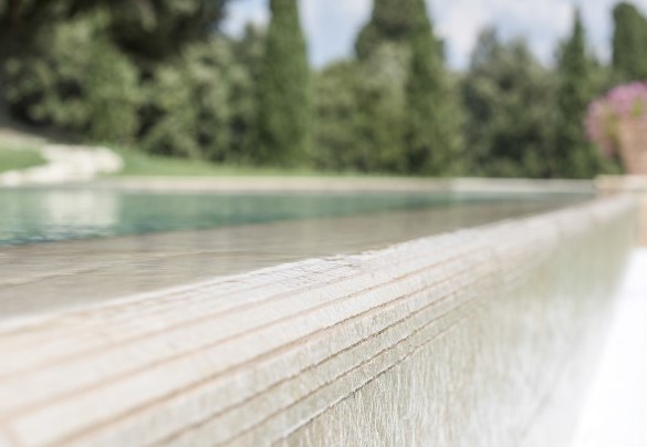 The surrounding solarium area is equipped with chaises longues, small tables and umbrellas – Villa Nicola