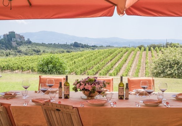 Two large umbrellas on the patio provide shade for the outdoor dining area – Villa Nicola