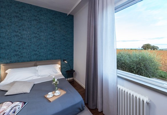 Double bedroom with a view of the countryside - Villa Ninetta