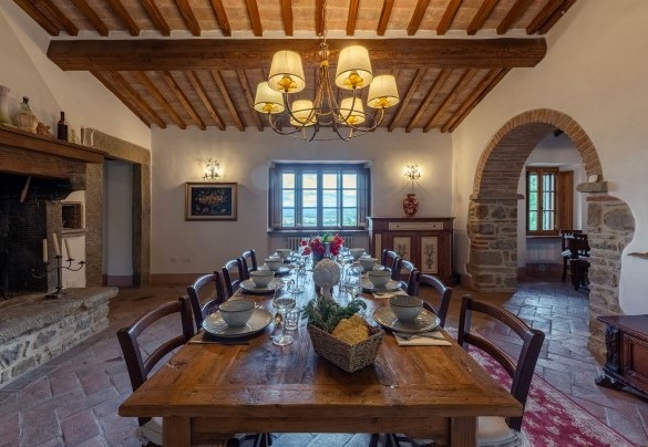 The dining area on the first floor with the table set - Villa Palazzolo