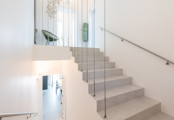The elegant internal staircase leading to the first floor - Villa Petrillo