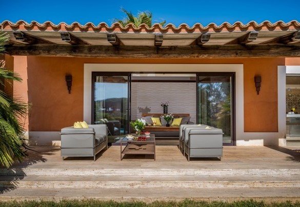  The portico in front of the living room host an outdoor seating area  - Villa Pineta
