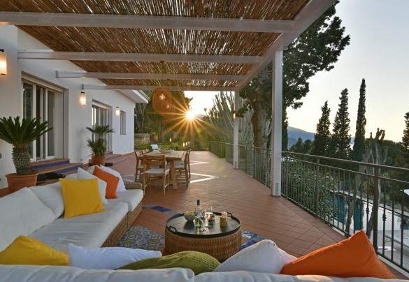 The terrace in front of the house is a lovely area where to relax on the large sofa or dine under the cane canopy – Villa Armonia