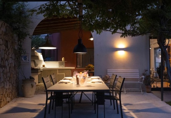 The outdoor dining area at night - Villa Talia
