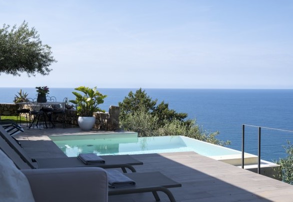 The pool is set into the cliffside terrace on the hillside - Villa Talia