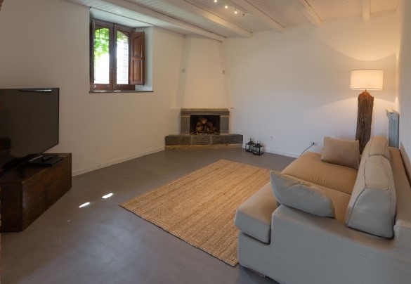 The TV lounge on the lower floor of the main house – Villa Terre Normanne