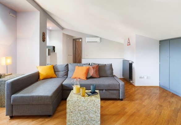 TV room furnished with comfortable sofas at the second floor – Villa Tiberio