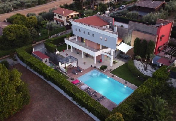 Bird’s eye view of the property in the evening lights – Villa Tiberio