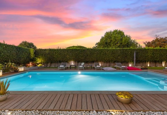 The garden and the pool in the sunset light – Villa Tiberio