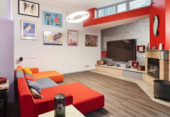 Large TV room with sofas and fireplace in the basement – Villa Tiberio