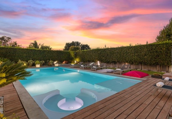 The garden and the pool in the sunset light – Villa Tiberio