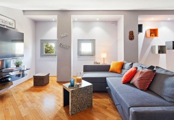 TV room furnished with comfortable sofas at the second floor – Villa Tiberio
