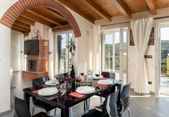 The living area leads to the large panoramic terrace - Villa Vittorio