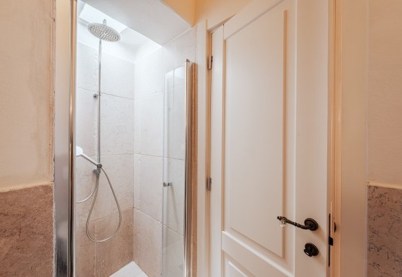 The bathroom with shower near the dining area - White Stone House