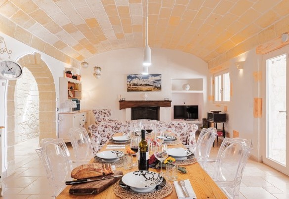 The dining table and the living room - White Stone House