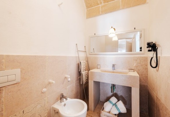 The bathroom with shower near the dining area - White Stone House